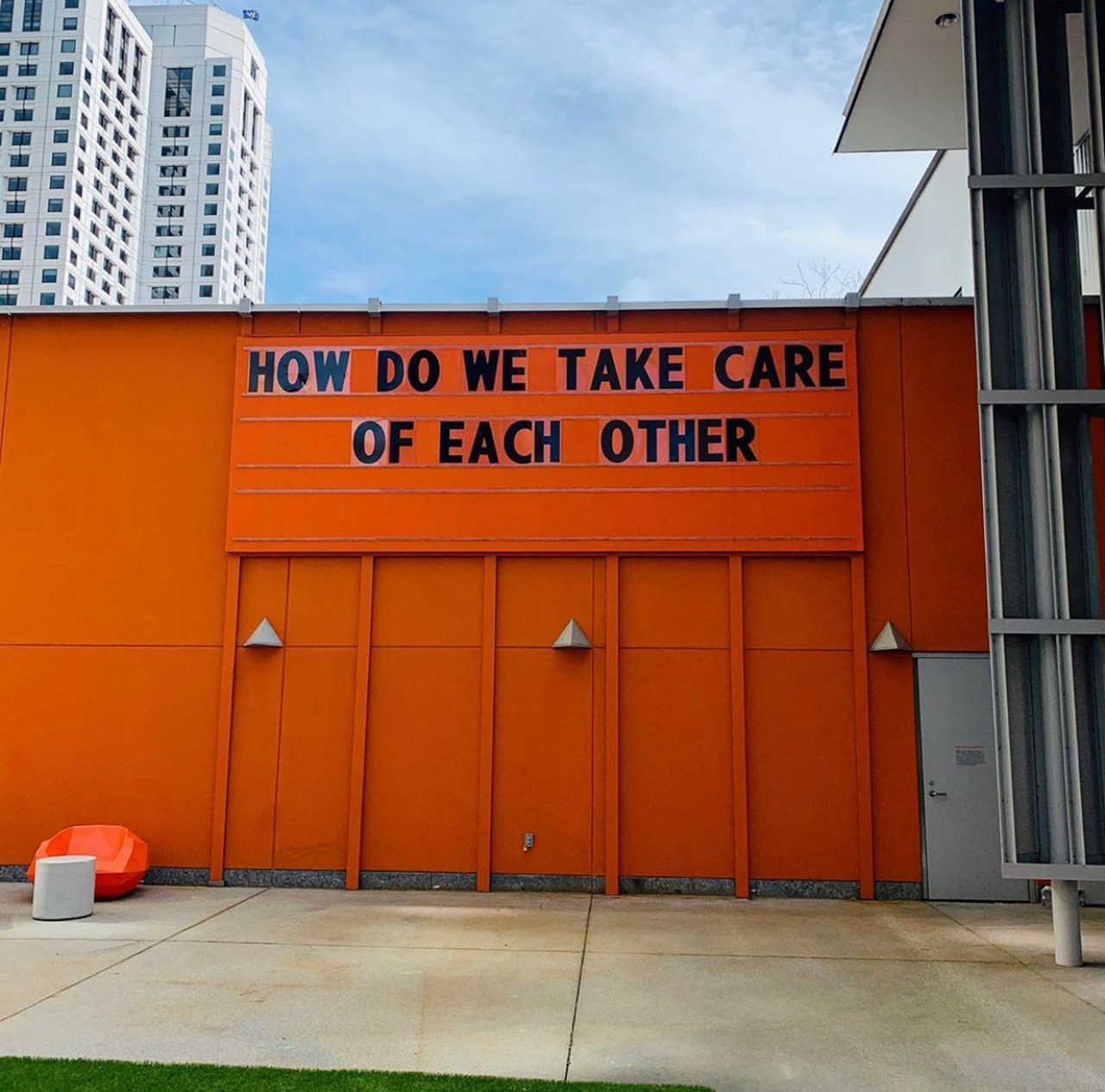Photo of text "How do we take care of each other" posted on the Yerba Buena Center for the Arts in San Francisco